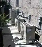 Six Mitsubishi MXZ30TN ductless condenser units installed on exterior wall of historic Land's End Inn Provincetown Massachusetts