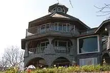Side angle view of the historic New London Maritime Museum building on an overcast day