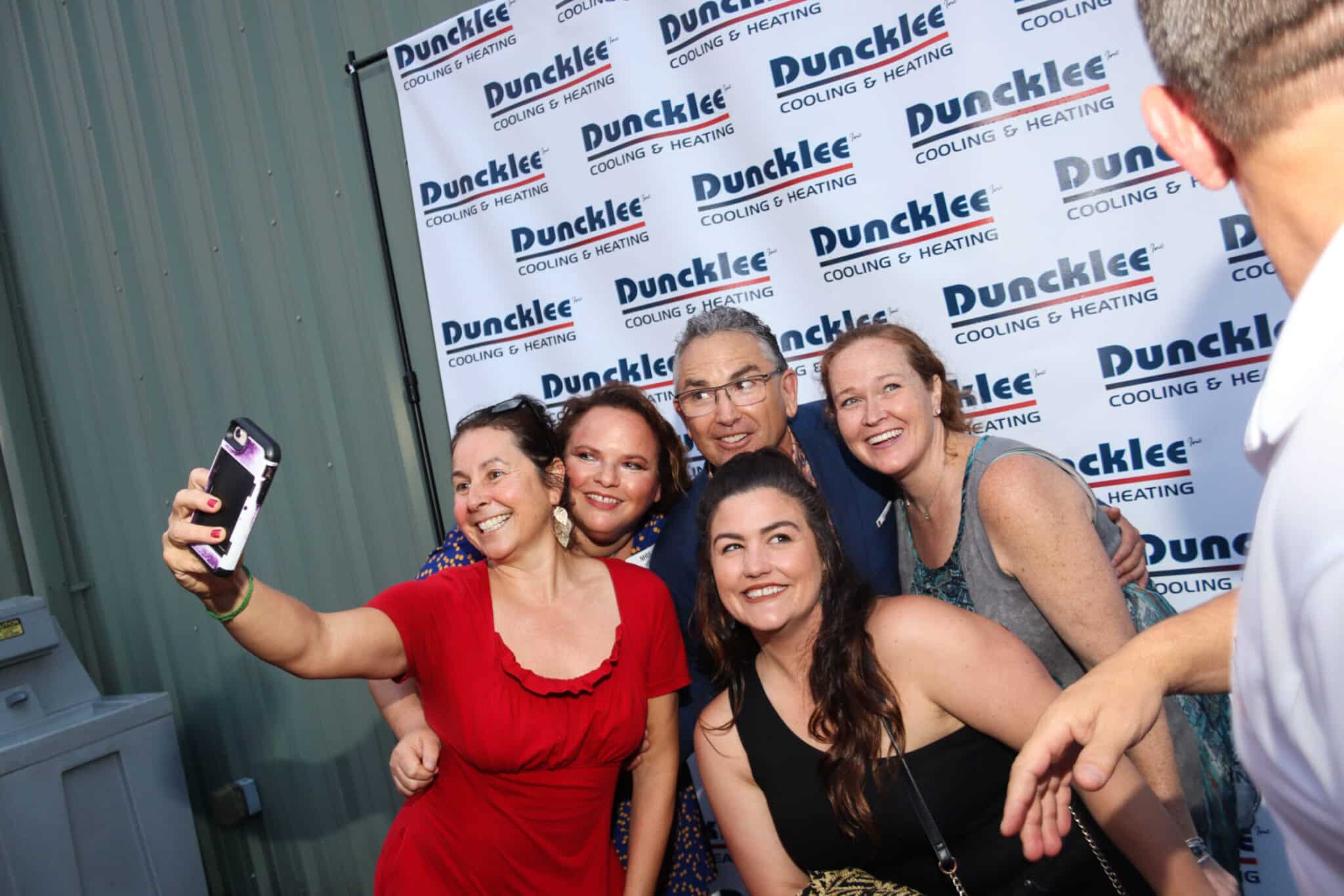 Anniversary Celebration Selfie Stonington A group of guests taking a fun group selfie at the Duncklee Cooling and Heating 50th anniversary in Stonington, CT.