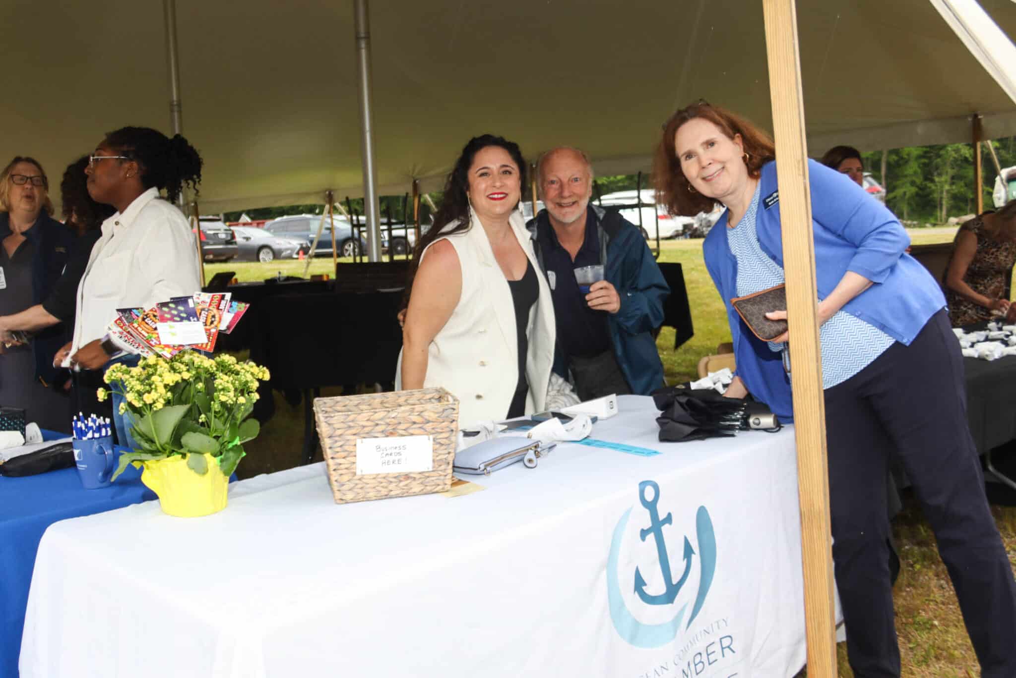 Anniversary Event Attendees Stonington CT Three women posing for a photo together at the Duncklee Cooling and Heating 50-year anniversary event in Stonington, CT