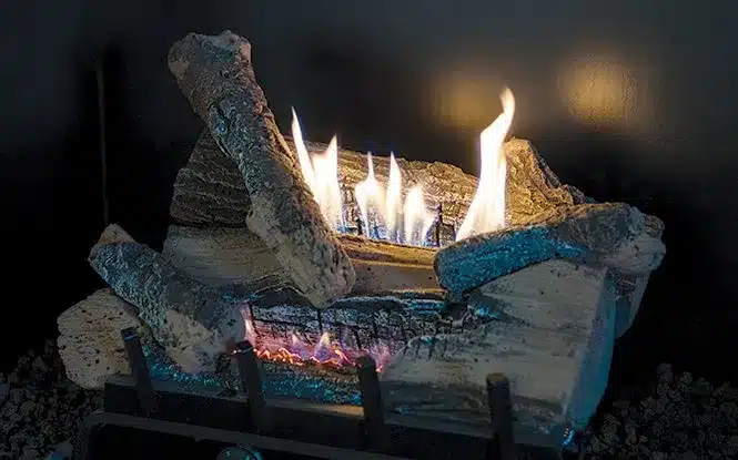 gas-logs-burner-detail-connecticut Gas fireplace with realistic logs and bright flames burning